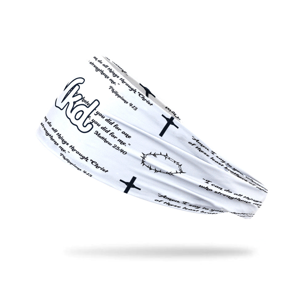 Photo of a white headband with black text, a cross and crown of thorns decorating all over it.