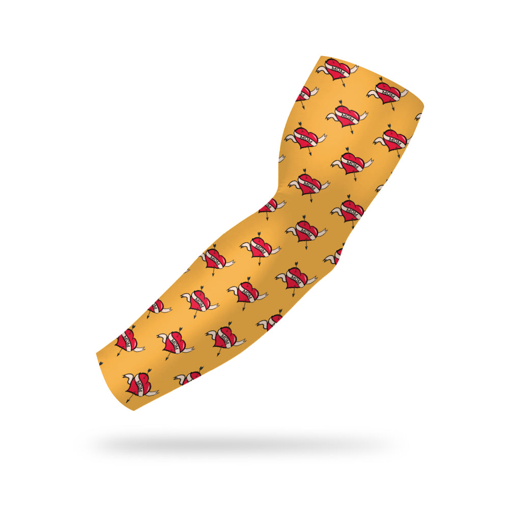 photo of a yellow compression sleeve with the text mom over a heart in a pattern spread across the sleeve on a white background.