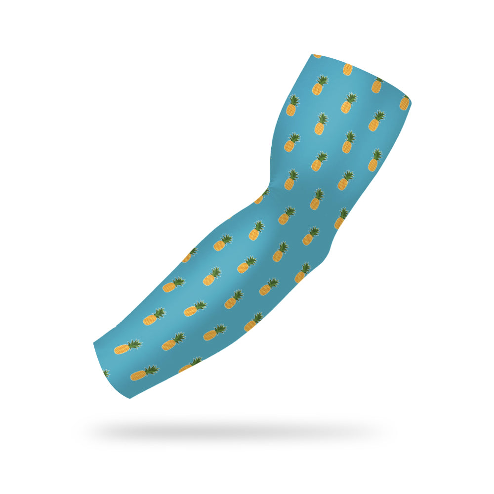 Photo of a blue armband with a pineapple icon printed all over it floating on a white background.