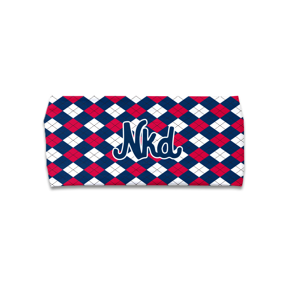 photo of a white headband with a red and blue plaid design with the NKD logo in the middle.