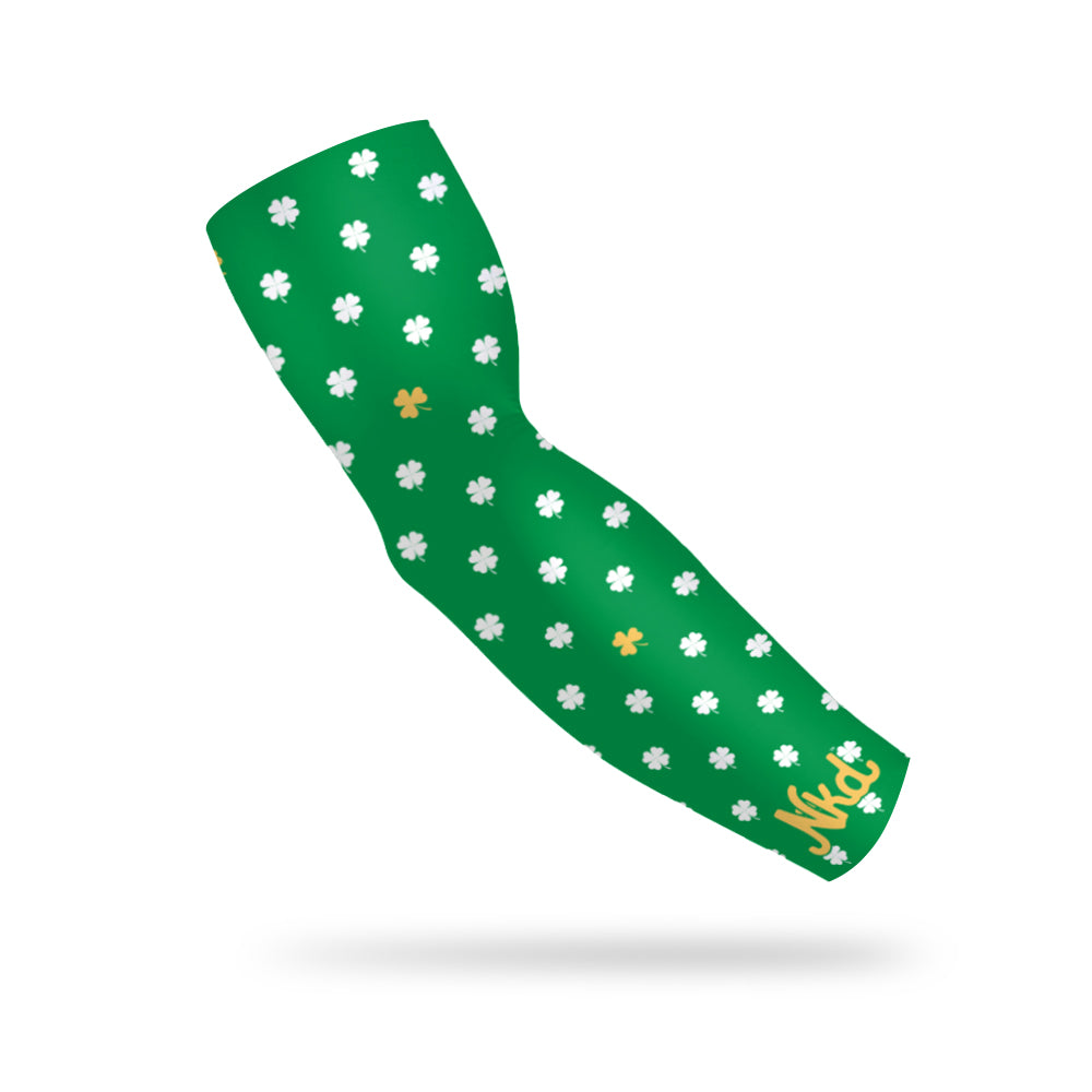 Photo of a green arm sleeve with a shamrock pattern in green and gold on a white background.