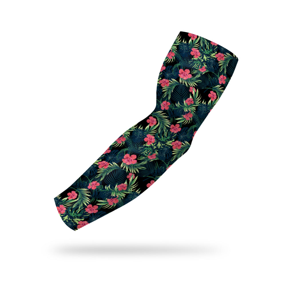 Photo of a black compression sleeve with a tropical pattern floating on a white background.