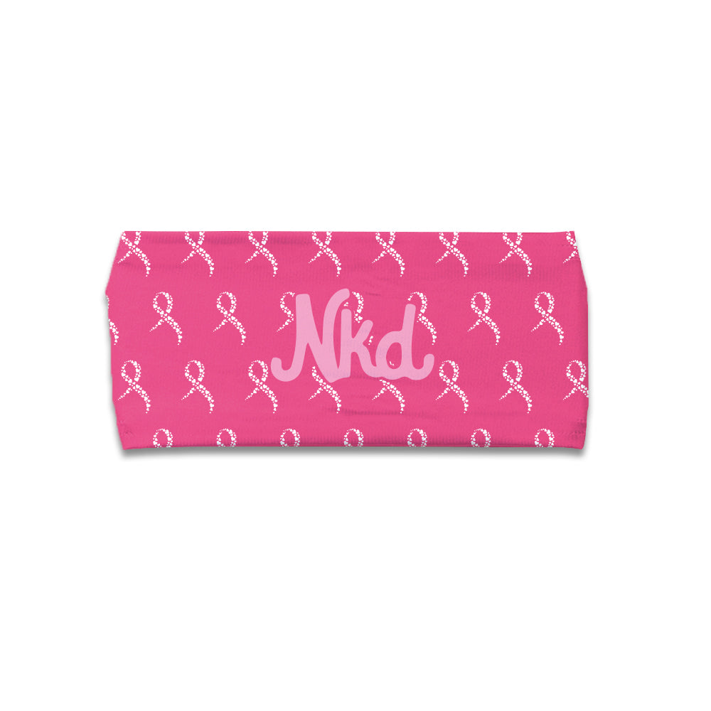 Photo of a pink headband decorated with white hearts in the shape of ribbons with a NKD in the middle on a white background.