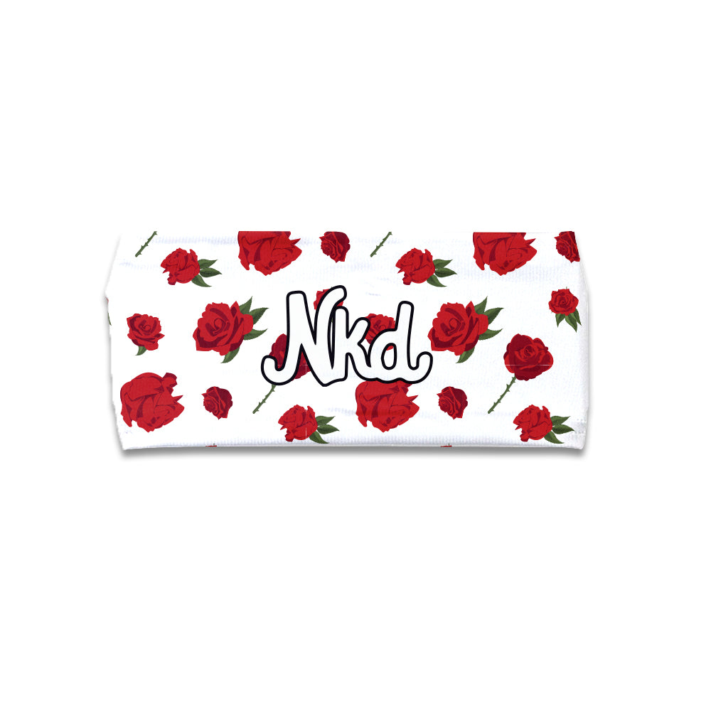 Photo of a white head band decorated with Roses on a white background.