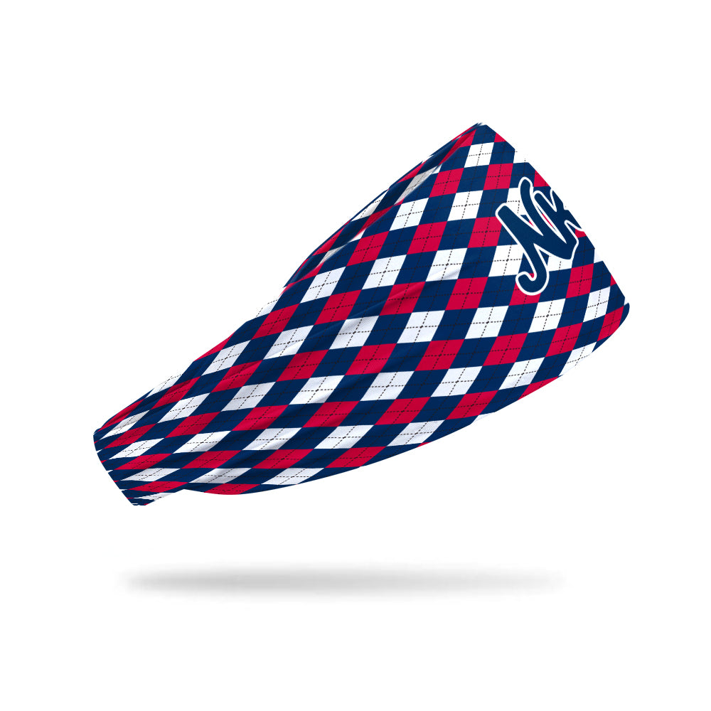 Photo of a white headband with a red and blue plaid design on a white background.