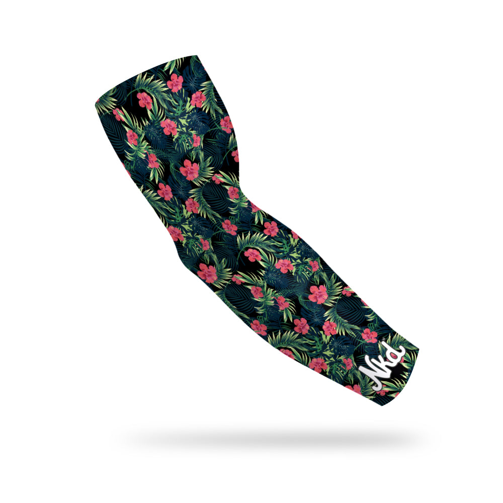 Photo of a black compression sleeve with a tropical pattern floating on a white background. 