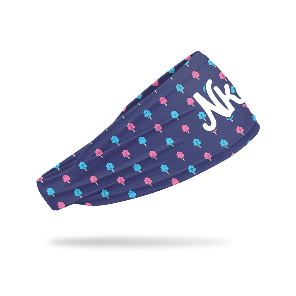 A navy colored headband with a pink and light blue cotton candy pattern on a white background. 