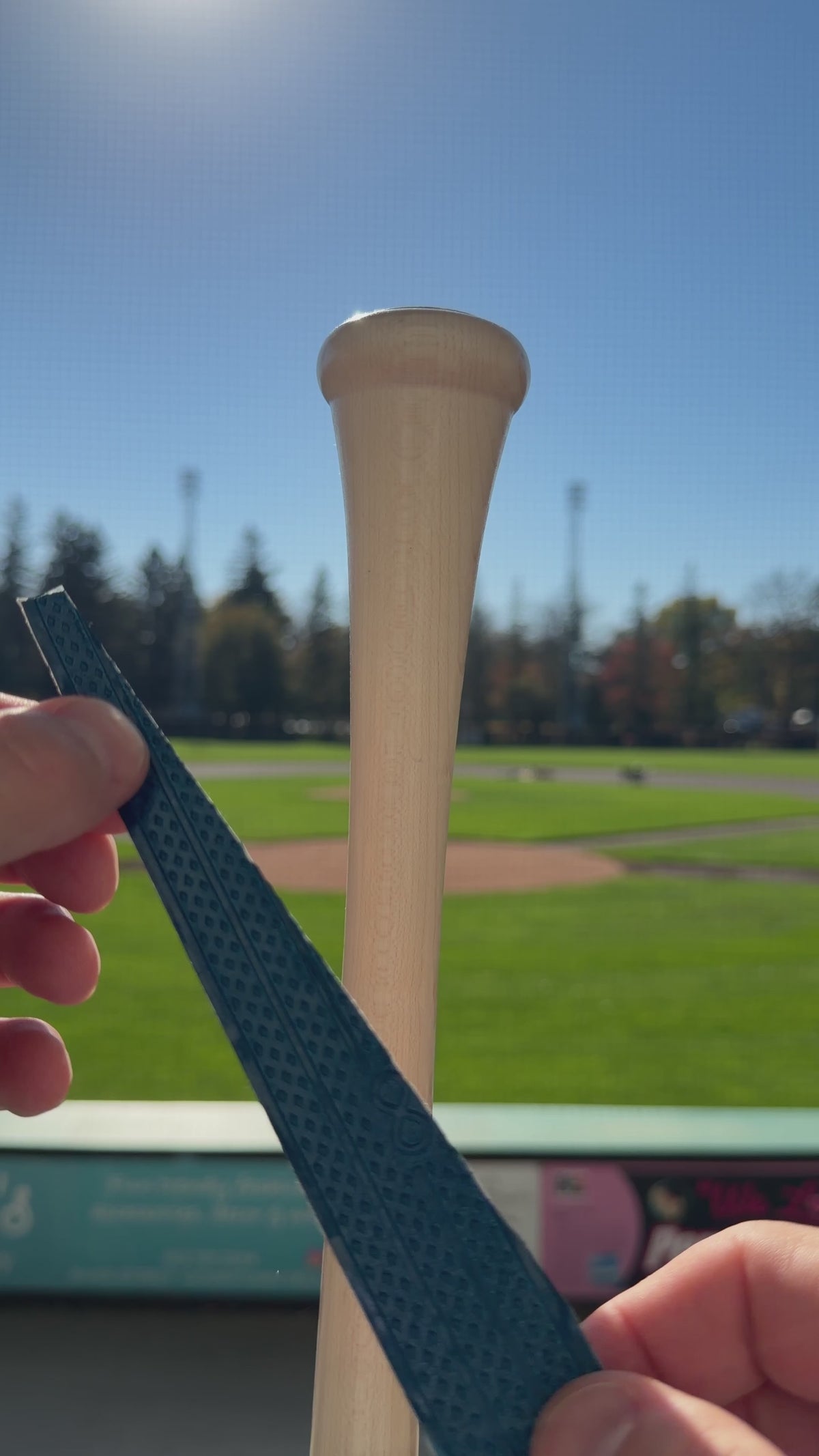 A vertical video showing how to properly wrap the "gone fishing" Bat grip around a wooden baseball Bat.